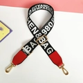 Detail showing adjustable black and white woven wide strap with red leather ends and gold clips - Bright Red