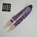Close-up of ethnic floral wide bag strap with gold metal buckles and pink leather joints - Morning Glory Light Pink