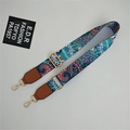 Detail of adjustable wide shoulder strap with blue paisley pattern and gold hooks - Phoenix Tail Ginger Yellow