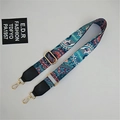Detail of adjustable paisley strap showing ethnic patterns and golden metal buckles - Phoenix Tail Black