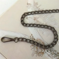 Detailed macro of gunmetal flat oval link chain strap with durable lobster clasp swivel hook - Gunmetal Swivel Hook 80cm
