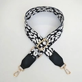 Close-up of leopard pattern wide bag strap with golden metal lobster clasps and leather ends - White