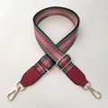 Detail of adjustable nylon strap with pink herringbone pattern and gold metal buckles - Black Gold Line + Wine Red