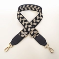 Close-up of adjustable chevron guitar style handbag strap with gold metal swivel snap hooks - Black
