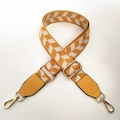 Detail of adjustable wide nylon shoulder strap with yellow geometric arrow patterns - Primrose Yellow Beige Grid