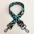 Detail of adjustable leopard print wide nylon strap with gunmetal swivel hooks - Light Blue Gunmetal Buckle