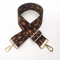 Detail of adjustable leopard print bag strap with polished light gold metal hardware - Coffee Leopard