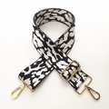 Detail of adjustable leopard print bag strap with high-quality gold metal lobster clasps - White Leopard