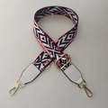 Close-up of ethnic woven bag strap with geometric patterns and golden metal clasps - Rainbow + White