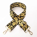 Detail of adjustable leopard print bag strap featuring heavy-duty gold metal lobster clasps - Yellow and Black Leopard