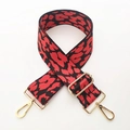 Detail of wide red and black leopard print bag strap with golden lobster clasps - Red Leopard