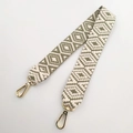 Detail of green and white geometric woven wide handbag strap with gold metal lobster clasps - Bean Green Short Style