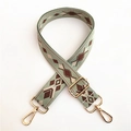 Detail of adjustable sage green bohemian canvas strap with geometric jacquard and gold clips - #6 Gold Clasp