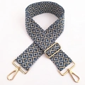 Detail van de geborduurde katoenen tasriem met gouden musketonhaken en verstelbare gesp - Blauw