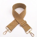 Detail van vintage geometrische jacquard tasriem met gouden metalen karabijnsluitingen - Geel