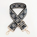 Dettaglio della tracolla in jacquard geometrico con ganci in metallo dorato e fibbia regolabile - Beige Blu Scuro Floreale