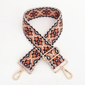 Dettaglio della tracolla jacquard colorata per borse con ganci a scatto in metallo oro - Blu Scuro Arancione Floreale