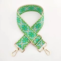 Dettaglio tracolla intrecciata con motivi etnici e ganci in metallo dorato lucido - Verde Blu Floreale