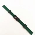 Detail view of dark green adjustable nylon backpack chest strap with black plastic buckle - Green