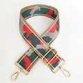 Detail of adjustable camouflage woven bag strap with metallic thread and gold lobster clasps - Silver Line No.17