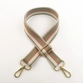 Close-up of adjustable striped thick cotton shoulder strap with gold metal hardware - Bean Green