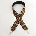Close-up of ethnic style embroidered shoulder strap with floral patterns and gold metal hooks - Style 9