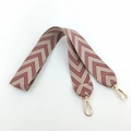 Detail of wide jacquard embroidered bag strap with brown herringbone pattern and gold hooks - Burgundy