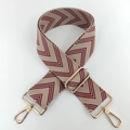 Detailed view of woven replacement strap with red V-pattern and gold metal buckles - Burgundy