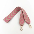 Detail of pink and beige geometric V-pattern embroidered shoulder strap with gold clips - Rose Pink