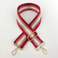 Dettaglio della tracolla in nylon regolabile con strisce verticali glitter oro e rosso - Linea Rossa Oro