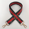 Detail eines 3,8cm breiten Taschengurt mit Punktmuster, rotem Streifen und Goldhaken - Schwarz und Orange Mit Goldener Schnalle