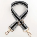 Close-up of 3.8cm wide adjustable strap with spotted weave and gold metal swivel hooks - Grey Gold Buckle