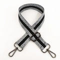 Detail of adjustable gray strap with white dots, black stripes, and gunmetal hooks - Grey Gunmetal Buckle