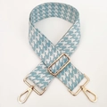 Close-up of sky blue houndstooth jacquard bag strap with gold metal lobster clasps - Haze Blue
