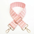 Macro detail of wide pink houndstooth woven bag strap with adjustable gold hardware - Light Pink