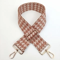 Detail of adjustable houndstooth shoulder strap with gold metal lobster clasps and buckle - Beige Brown