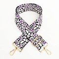 Macro shot of purple leopard print wide bag strap with polished gold adjustable metal hardware - Black White Purple