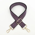 Close-up of woven geometric patterned strap with adjustable gold-toned metal hooks - Black Burgundy (Gold Buckle)