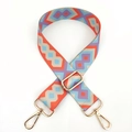 Detail showing colorful geometric patterned wide strap with gold metal lobster clasps - Orange Blue Purple