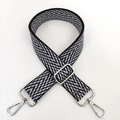 Close-up of woven herringbone bag strap with silver metal swivel hooks and adjuster - Black Khaki (Silver Buckle)