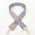 Close-up of geometric pattern shoulder strap with gold metal buckles for handbags - Purple