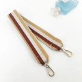 Close-up of striped woven bag strap in brown and beige with gold lobster clasps - Yellow Short Style
