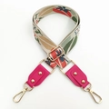 Detail of colorful floral embroidered canvas strap with pink leather ends and gold rivets - Rose Red