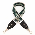 Detail of adjustable camouflage jacquard bag strap with gold metal hooks and black leather ends - Dark Green