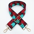 Close-up of 5cm wide adjustable bag strap with red and turquoise polka dot pattern and gold hooks - Navy Blue Red Blue