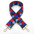 Detail of adjustable wide shoulder strap with red and blue polka dots and gold metal buckles - Black Grey Red