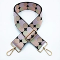 Detailaufnahme des verstellbaren Riemens mit bunten Polka-Dots und goldenen Karabinerhaken - Schwarz Rosa Khaki