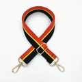Adjustable woven strap with black, red and yellow stripes and golden metal hardware - Black Daisy