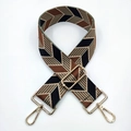 Detail of wide woven jacquard shoulder strap with geometric diamond patterns and gold hooks - Black Brown
