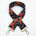 Detail of wide woven strap with geometric arrow pattern and gold metal hardware - Black Daisy